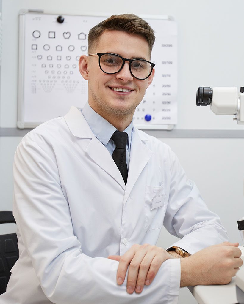 male-optometrist-smiling-at-camera-2021-04-06-16-28-38-utc.jpg
